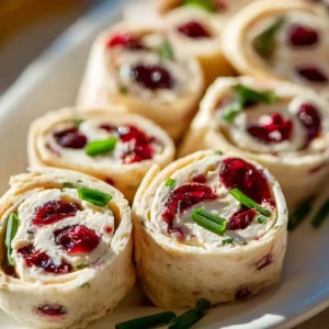 Festive Christmas Cranberry Roll Ups 2 Festive Christmas Cranberry Roll Ups with fruit and festive decorations