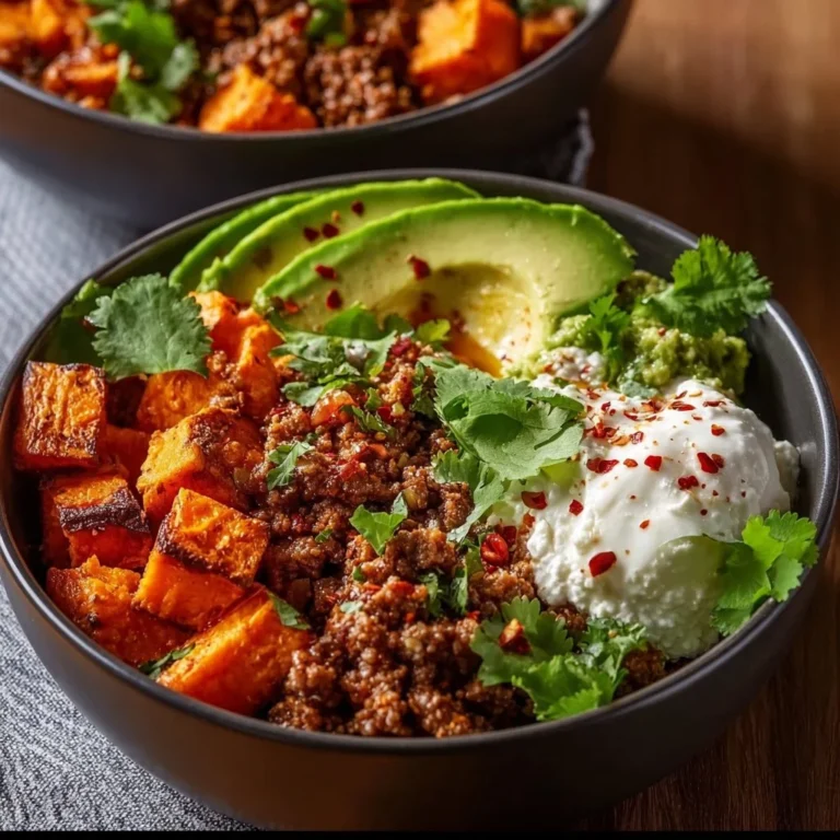 Delicious sweet potato taco bowl topped with fresh ingredients and served in a bowl