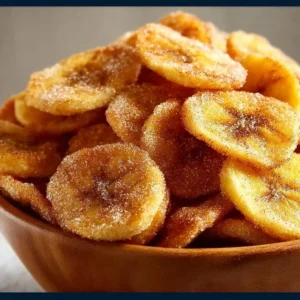 Cinnamon-Sugar Air Fryer Banana Chips 2 Cinnamon-sugar air fryer banana chips in a bowl, perfect for snacking.
