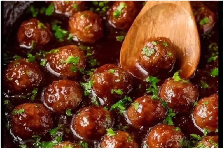 Grape Jelly Meatballs 3 Grape jelly meatballs served on a platter for a delicious appetizer.