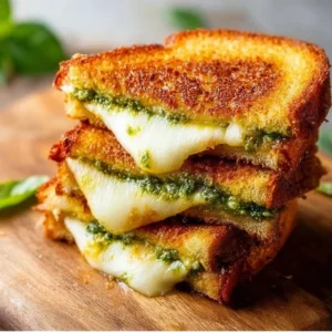 Pesto Grilled Cheese 2 Pesto grilled cheese sandwich with gooey cheese and fresh basil pesto